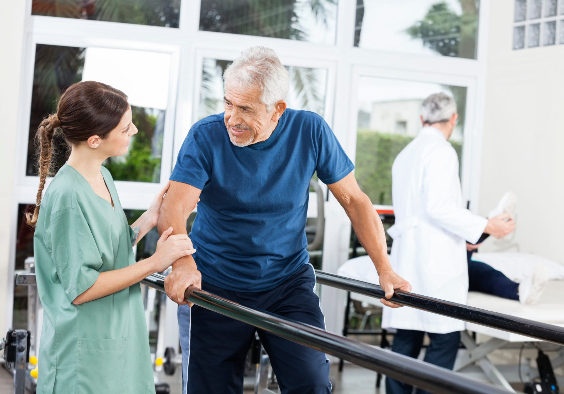 Patient Looking At Female Physiotherapist While Walking Between gait analysis